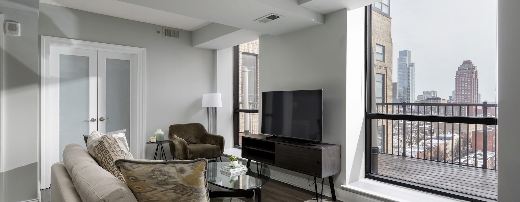 a living room with a couch and a tv