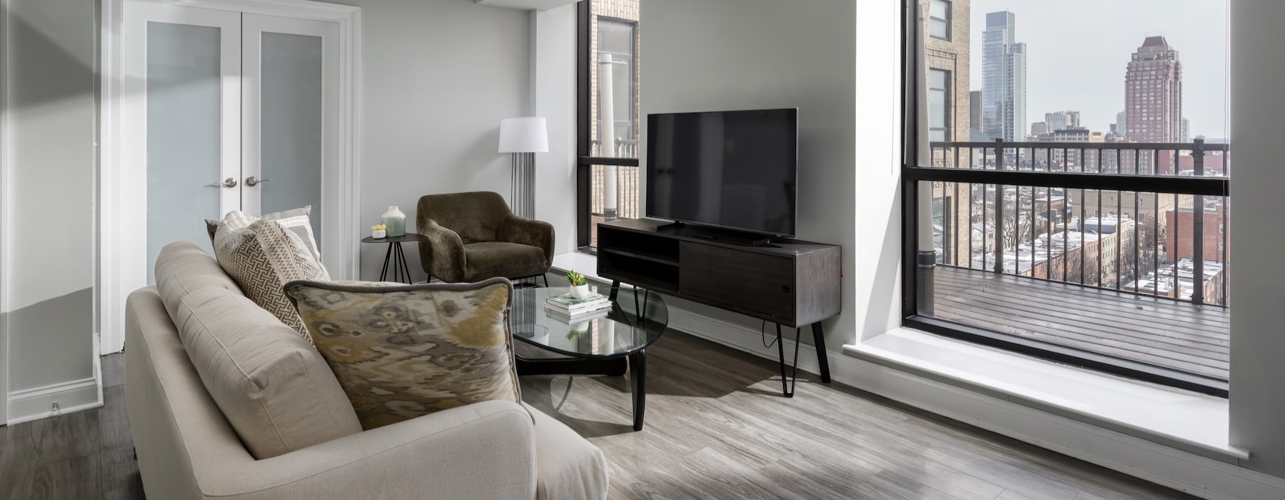 a living room with a couch and a tv