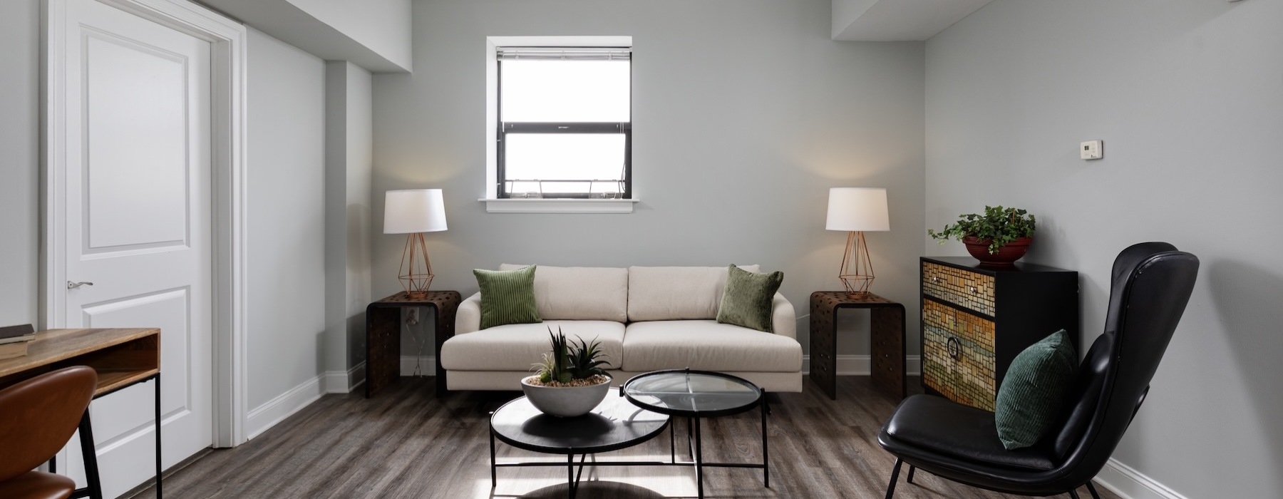 a living room with a couch and chairs