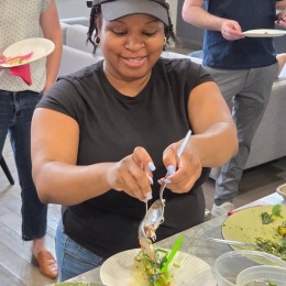 a woman fixing a plate