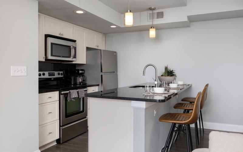 a kitchen with chairs