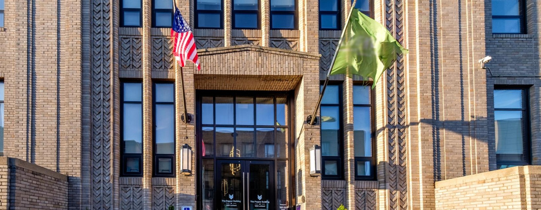a building with flags on the front