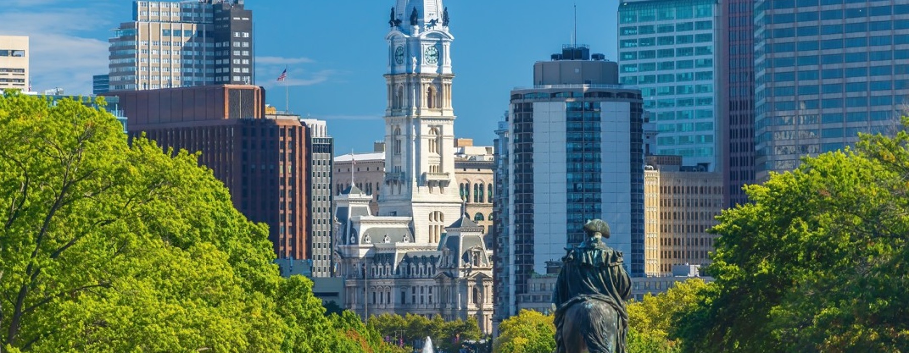 Philadelphia City Hall tower viewed down Benjamin Franklin Parkway with equestrian statue