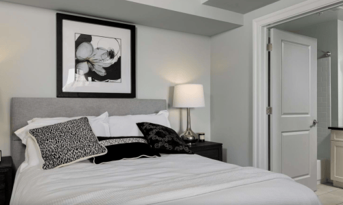 Furnished bedroom with en suite bathroom at The Pepper Building in Philadelphia