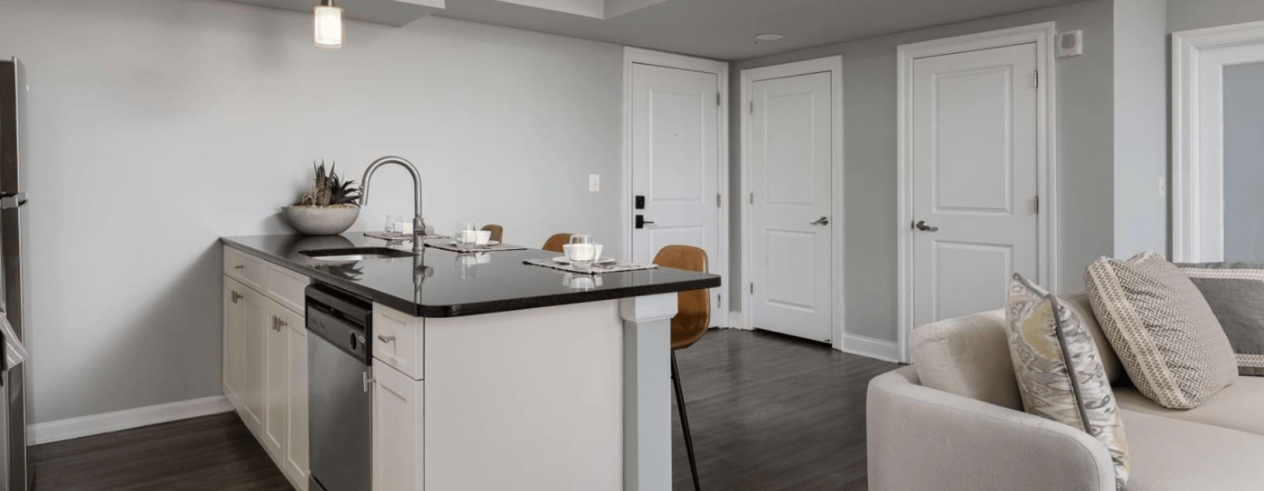 Open kitchen island and living area in a two-bedroom Philadelphia apartment